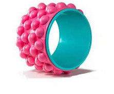 Pink and teal textured ball on a white background
