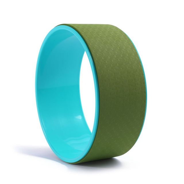 Green and turquoise yoga wheel on a white background